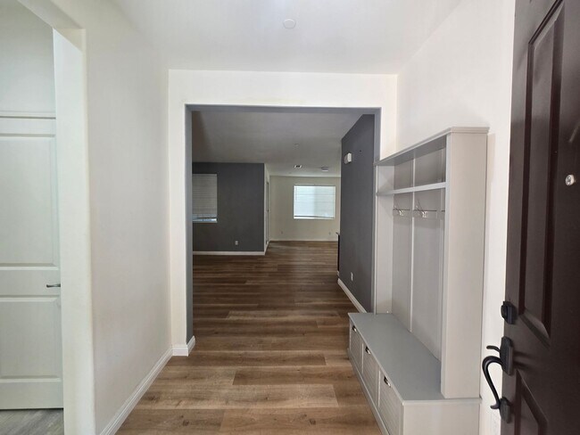 Building Photo - Open-Concept Living with Downstairs Bedroom & Enclosed Patio Retreat