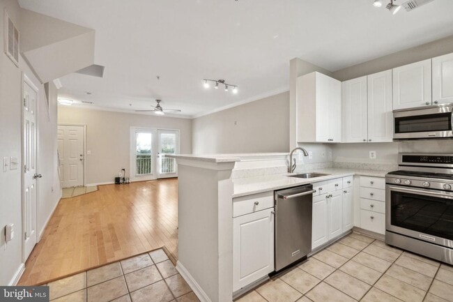 Building Photo - This townhouse style condo is located across the street from the Vienna Metro Station (Orange Line).