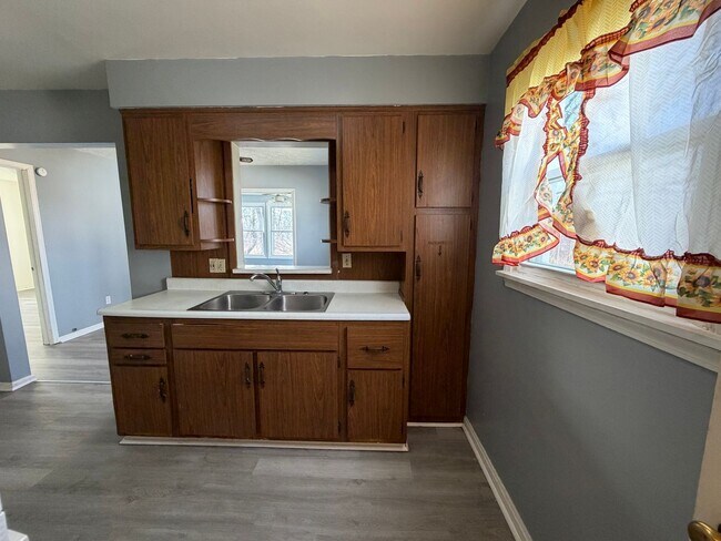 Building Photo - Bright Cape w/ Sunroom, Central Air, Big Basement & Backyard Shed