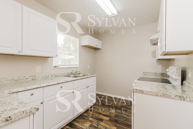 Building Photo - This charming home is ready for your personal touch!