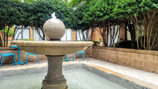 Take a break from the city and relax in the secluded courtyard with lots of green space and a water feature - 525 E 6th Street