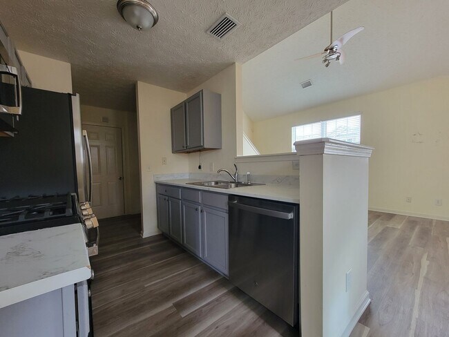 Building Photo - Lake Front Property. Loft - Swim/Tennis - Stainless Steel Appliances