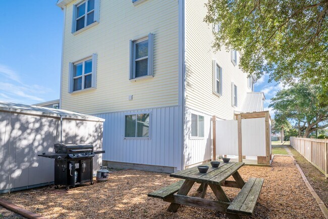 Building Photo - PRICE REDUCTION! LIVE AT THE BEACH FOR THE...