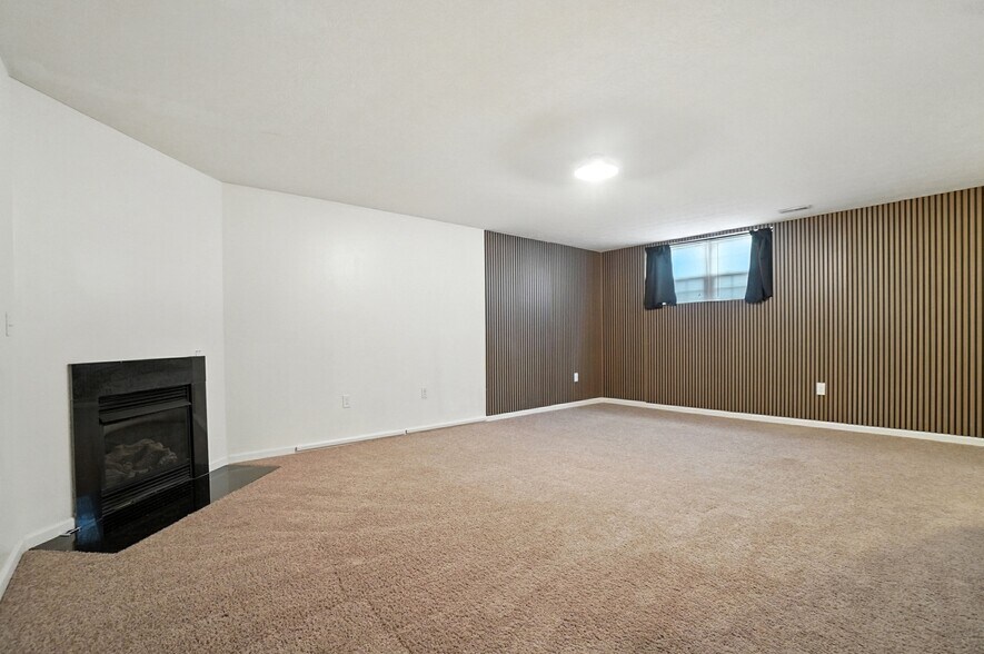 Basement with beautiful wood paneling - 6169 Needletail Rd