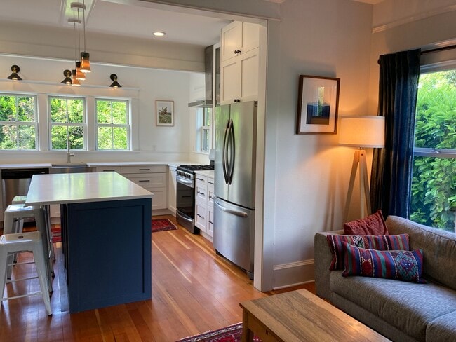 Adjacent to the kitchen is a large dining room with huge east-facing windows. - 1405 NE Buffalo St