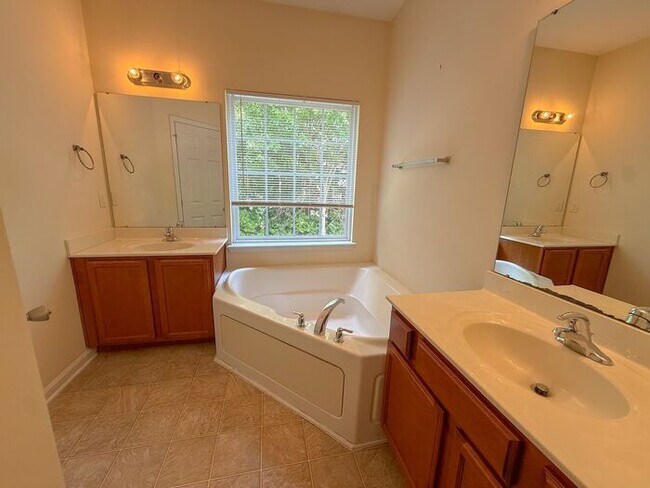Building Photo - Beautifully updated Townhome! New cabinets, granite counter tops, and LVP flooring through downst...