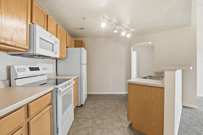 Building Photo - $1,690.95, 2-bed, 2-bath condo in a gated community with a washer/dryer.