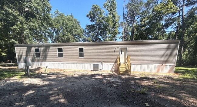 Building Photo - Brand new 4BR Mobile Home - Country living with City convenience!