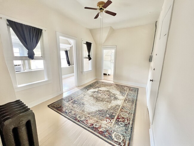 Explore this inviting corridor, where elegance meets simplicity in a well-lit space. - 1458 N Gaylord St