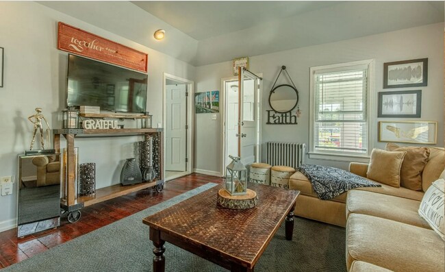 Living room and door to primary bedroom - 407 S Main St