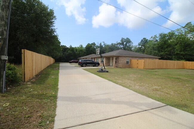 Building Photo - West Pensacola Duplex Living — 3BR Home with Open Floor Plan, Eat-In Kitchen, Covered Patio & Low...