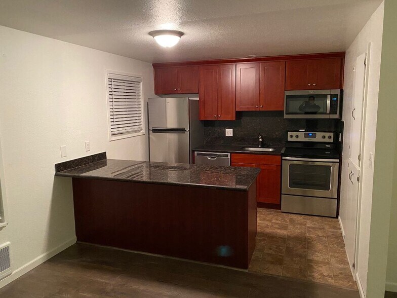 kitchen with stainless steel appliances - 617 SW 3rd Pl
