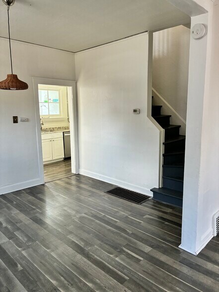 other half of kitchen and stairs up - 212 E 3rd Ave