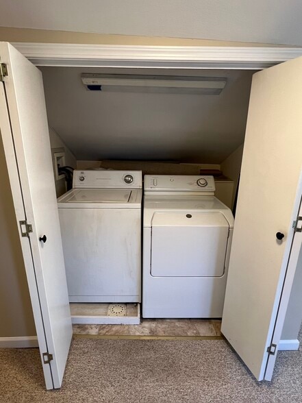 Laundry closet located upstairs between the bedrooms and the bonus room. - 176 Duer St