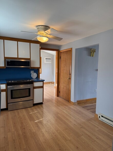 Kitchen leading to family room - 87 Auburn St
