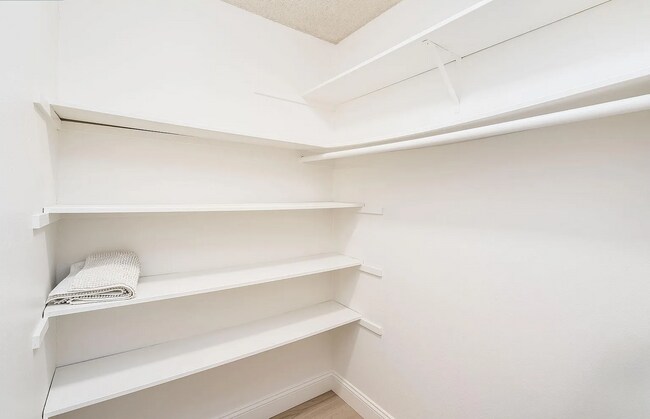 Building Photo - The updated bathroom offers a shower-over-...