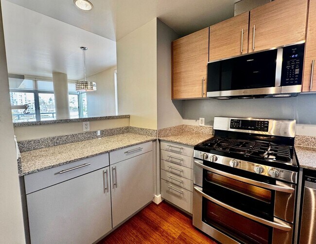 Building Photo - Corner Light. City Energy. Zero Compromise.