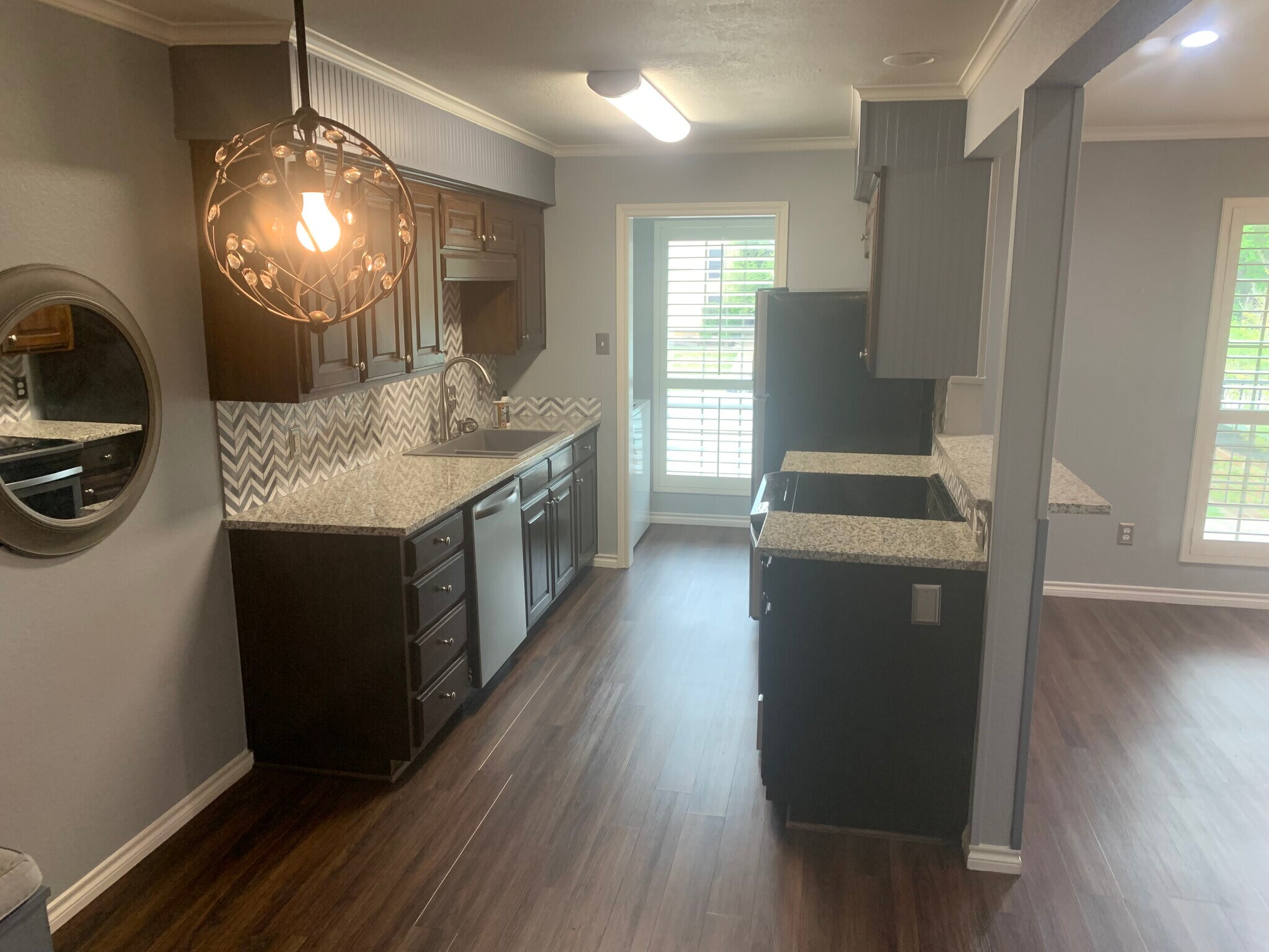 Kitchen with connecting utility room. - 3641 Bryce Ave