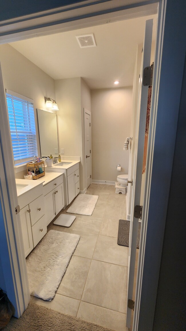 Primary bathroom with double vanities - 610 Vestrella Rd