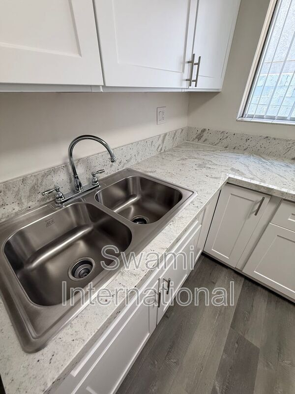 Building Photo - 13448 1/2-13612-22 Doty Ave