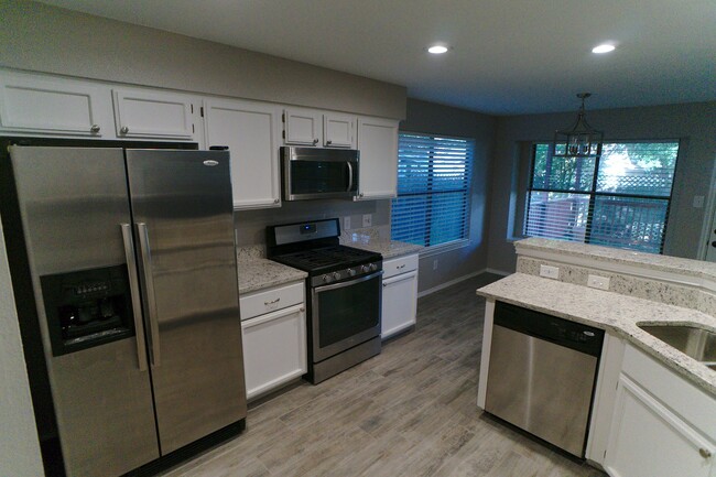 Kitchen with Granite and Stainless Appliances - 12905 Modena Trail