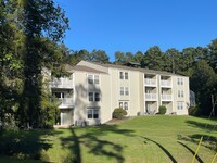 Building Photo - Perfectly located, quiet apartment complex...