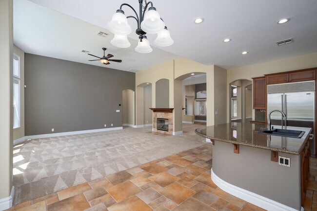Convenient open floor plan integrates the kitchen and family room with incredible mountain views. - 2850 Bronzino Ct