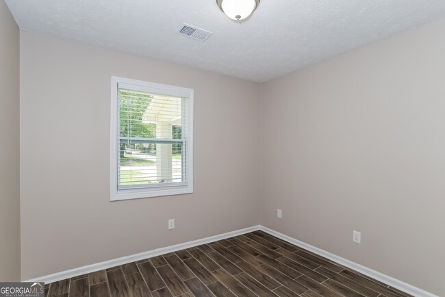 Building Photo - 9073 Woodgreen Way