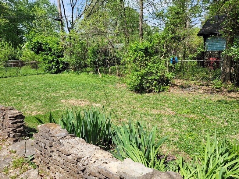 backyard - looking to the right back corner of lot from back of carport - 8011 Greenway Dr