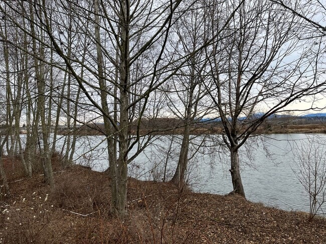 Building Photo - Riverfront Townhome with Tandem Garage & Fenced Yard