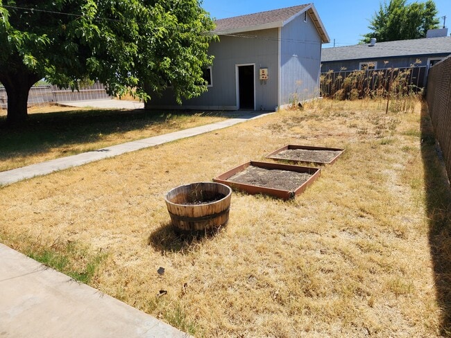 backyard showing detached garage - 1994 Baugh St