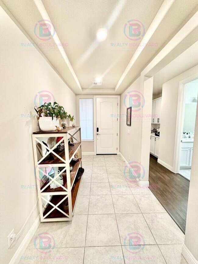 Building Photo - Welcome to your dream home, where modern elegance meets unparalleled convenience!