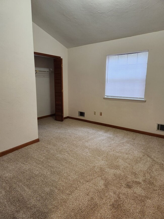 Building Photo - Two Bedroom, Two Bath Townhome With A Private Patio & Fenced Backyard.