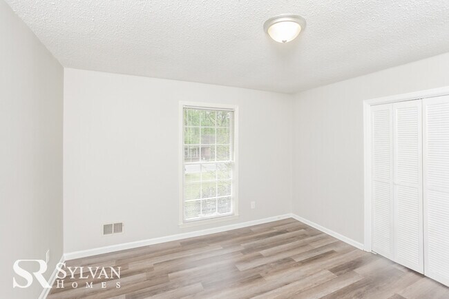 Building Photo - Come view this charming brick home