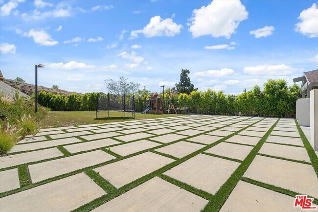 Building Photo - 11700 Woodley Ave