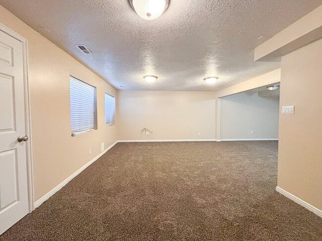Building Photo - Spacious 5-Bedroom Home in Stansbury Park ...