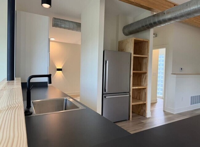 Building Photo - Vaulted Ceilings & Hardwood Floors in This Charming Indianapolis L