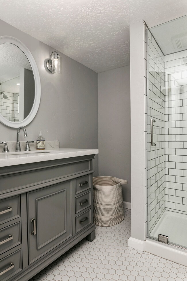 Downstairs bathroom with walk-in shower. - 2117 W Jefferson St