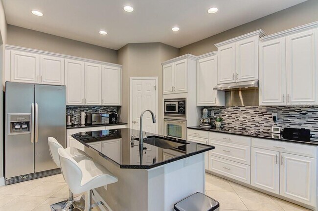Building Photo - 4/3 Stylish and Spacious 2-story home with...