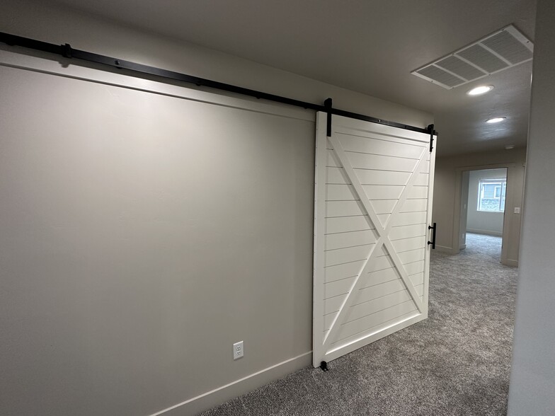 Laundry Hides away behind barn door - 187 Courthouse Way