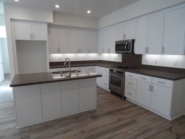 Primary Photo - 4BR 3BA two-story condo with 2 Car Attache...