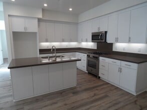 Building Photo - 4BR 3BA two-story condo with 2 Car Attached Garage