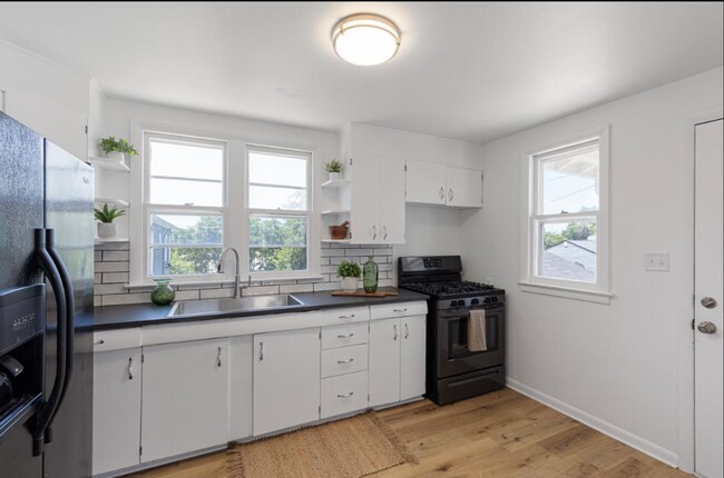 Building Photo - Updated South Omaha Home with Oversized Ga...