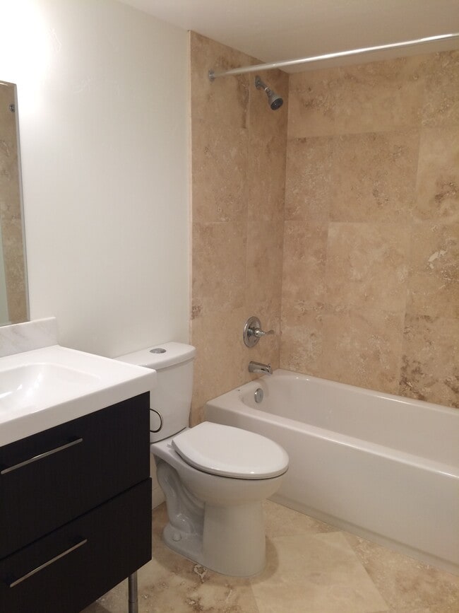 well appointed bathrooms with travertine - 5941 Mildred Street