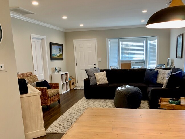 Living room facing front entry door - 900 N El Molino Ave.