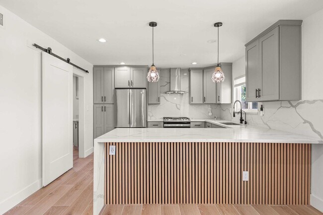 Building Photo - Stylishly Remodeled 4-Bedroom Home in Prim...