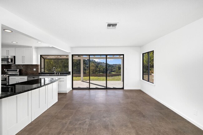 Building Photo - Modern Elegance Above the Greens: Premier Via Verde Estate with Panoramic Views