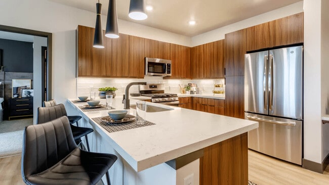 Kitchen with Breakfast Bar and Stainless Steel Appliances - Circa Fitzsimons