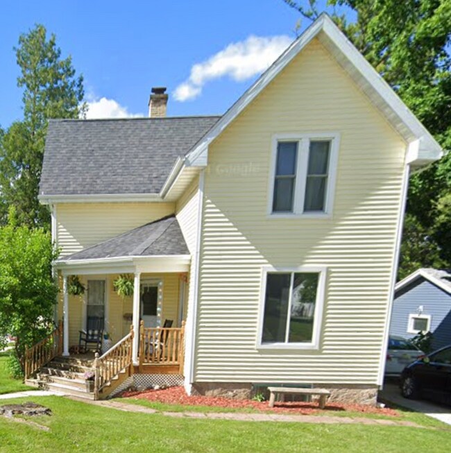 Front: covered porch & mulberry bush - 204 Edna St