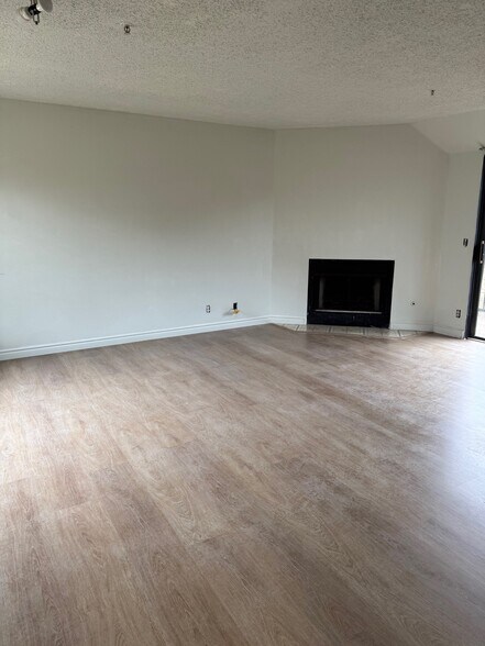 Living Room with Fire Plate - 819 S Golden West Ave